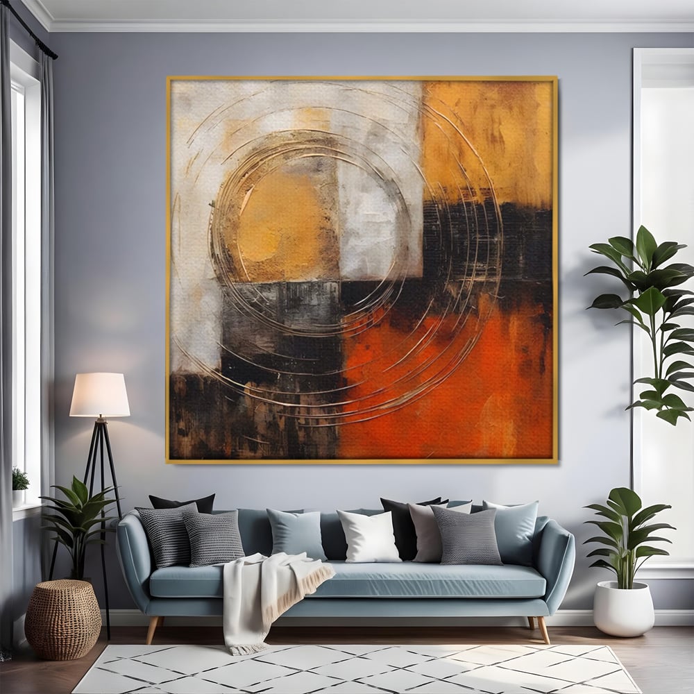 Tablou canvas cu pictura abstracta cu cercuri suprapuse, in rama de aluminiu auriu, pe perete intr-un living
